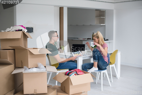 Image of Young couple moving in a new home