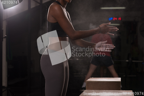 Image of black woman preparing for climbing workout