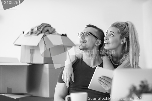 Image of Young couple moving in a new home