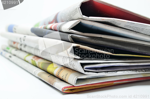 Image of Newspapers folded and stacked 
