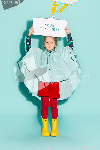 Image of Little girl posing in fashion style wearing autumn clothing.