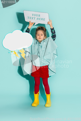 Image of Little girl posing in fashion style wearing autumn clothing.