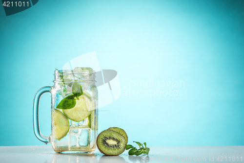 Image of The rose exotic cocktail and fruit on blue