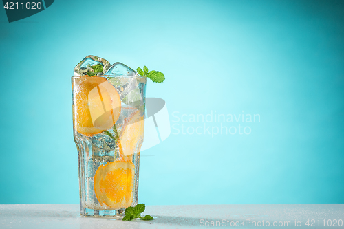 Image of The rose exotic cocktail and fruit on blue