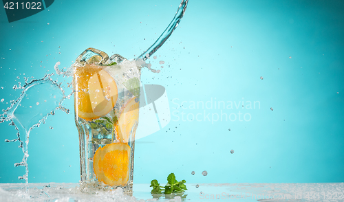 Image of The rose exotic cocktail and fruit on blue