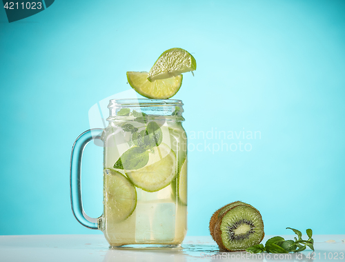 Image of The rose exotic cocktail and fruit on blue