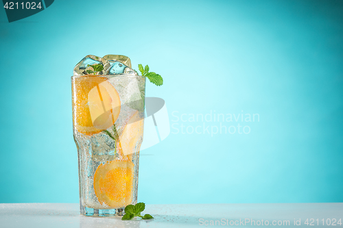 Image of The rose exotic cocktail and fruit on blue
