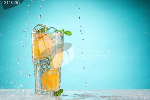 Image of The rose exotic cocktail and fruit on blue