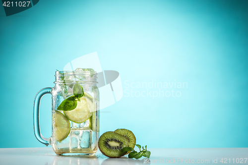 Image of The rose exotic cocktail and fruit on blue