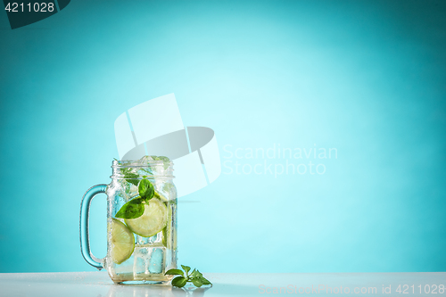 Image of The rose exotic cocktail and fruit on blue