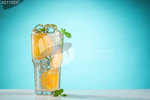 Image of The rose exotic cocktail and fruit on blue