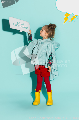 Image of Little girl posing in fashion style wearing autumn clothing.