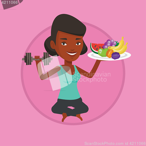 Image of Healthy woman with fruits and dumbbell.