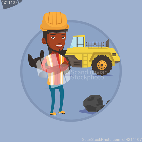 Image of Miner with a big excavator on background.