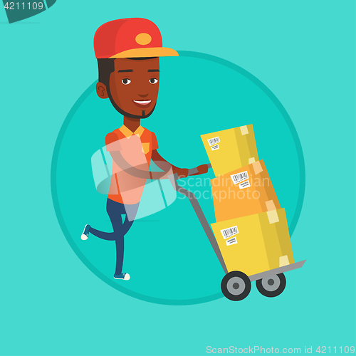 Image of Delivery postman with cardboard boxes on trolley.