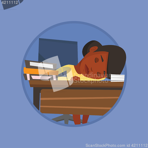 Image of Female student sleeping at the desk with book.