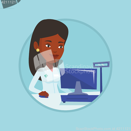 Image of Pharmacist at counter with cash box.