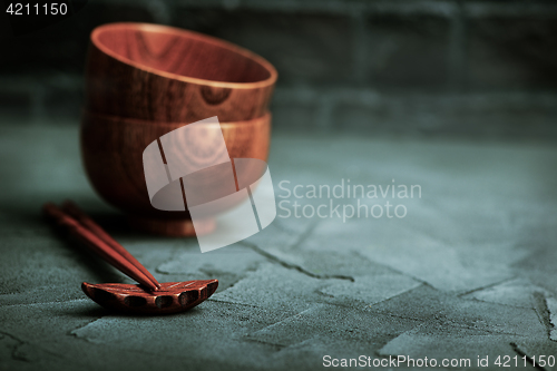 Image of wood bowl with wooden chopsticks