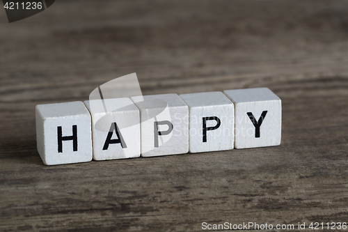 Image of Happy, written in cubes