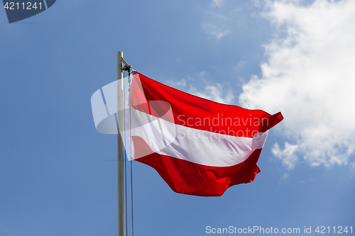 Image of National flag of Austria on a flagpole