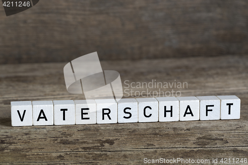 Image of German word fatherhood, written in cubes