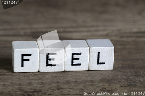 Image of Feel, written in cubes