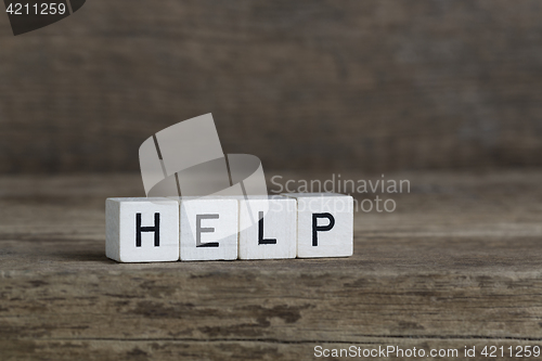 Image of Help, written in cubes