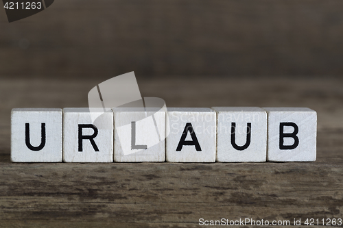 Image of German word vacation, written in cubes