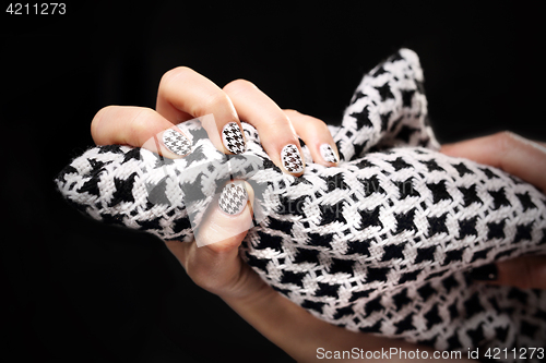 Image of Chanel grille on the nails, black and white manicure