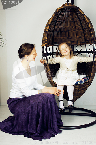 Image of young mother with daughter at luxury home interior vintage