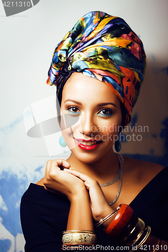 Image of beauty bright african woman with creative make up, shawl on head