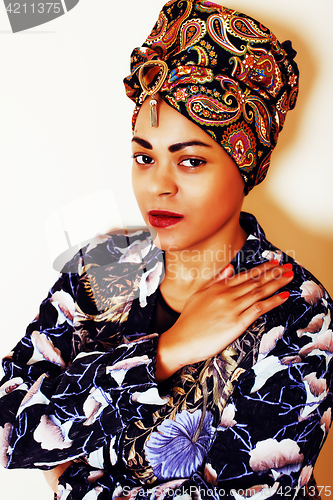 Image of beauty bright african woman with creative make up, shawl on head