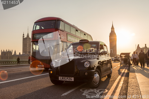 Image of Traffic and random people on Westminster Bridge in sunset, London, UK.