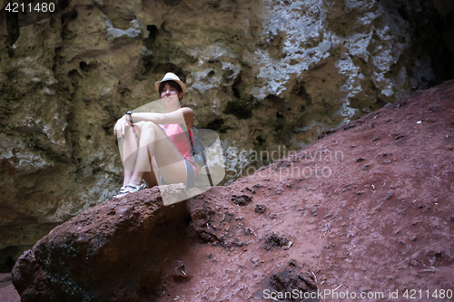 Image of Girl on hill among mountains