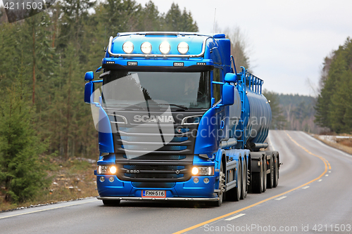 Image of Blue Scania R580 Tank Truck Headlights on Rural Road