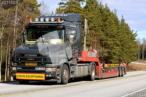 Image of Black Conventional Scania 164L Semi Trailer on Road