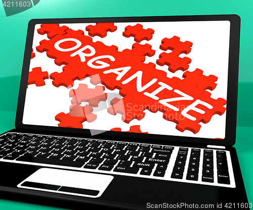 Image of Organize Puzzle On Notebook Shows Files Management