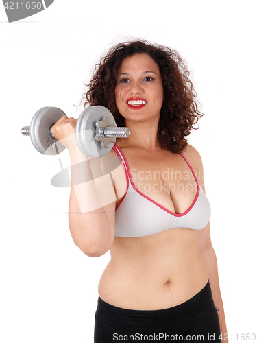 Image of Busty woman with dumbbells.