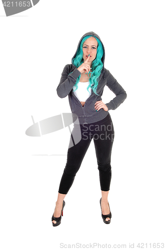 Image of Woman standing with blue hair.