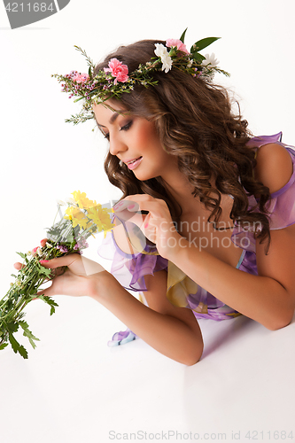 Image of Young Woman With Flower Garland