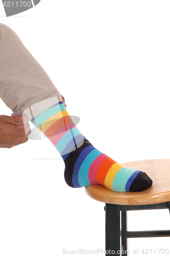 Image of Closeup of foot with colorful socks.