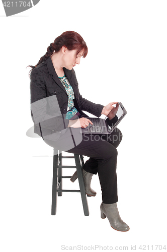 Image of Woman working with her tablet.