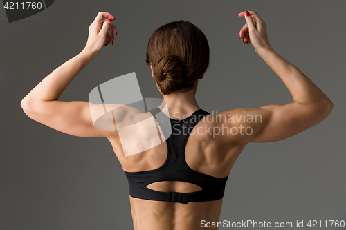 Image of Sporty girl back with muscles