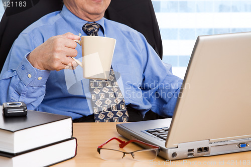 Image of Working mature businessman