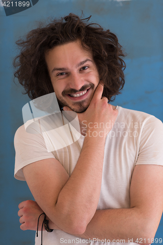 Image of young man with funny hair over color background