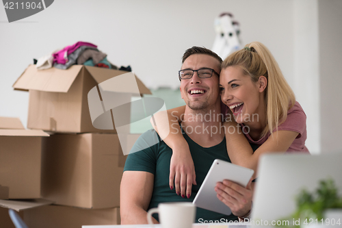 Image of Young couple moving in a new home