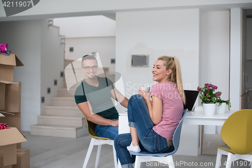 Image of Young couple moving in a new home