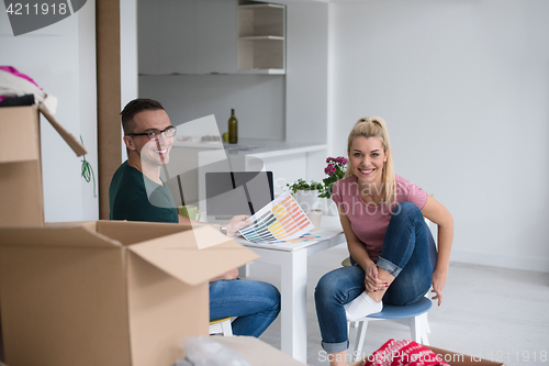 Image of Young couple moving in a new home