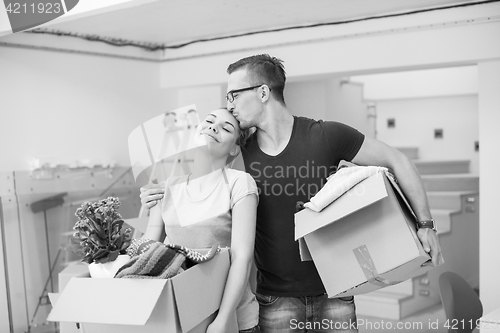 Image of young couple moving into a new home