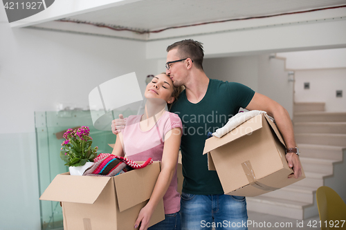 Image of young couple moving into a new home